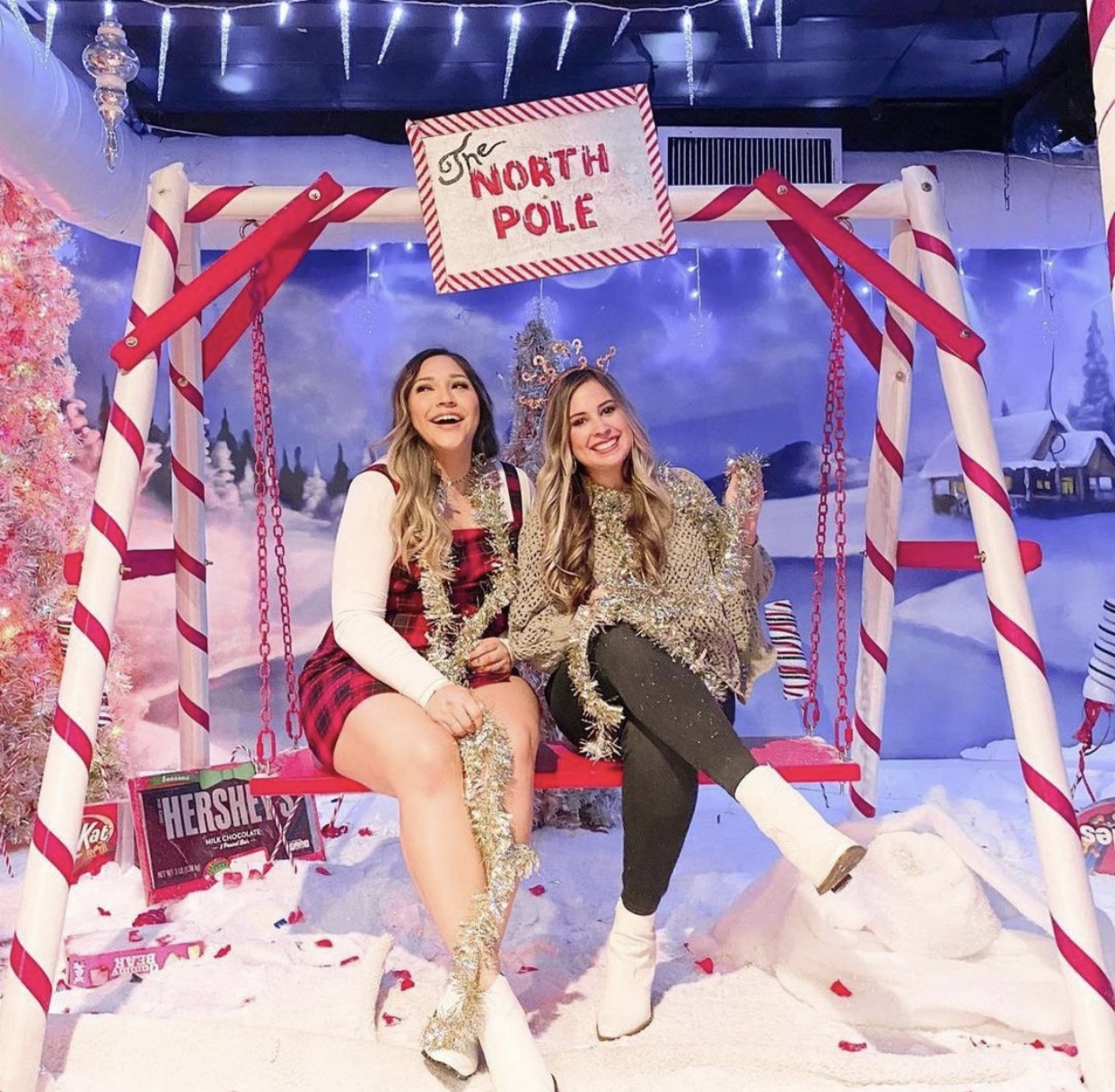 North Pole themed Christmas pop-up bar photo moment with candy cane swing in Houston